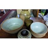 A studio pottery vase and matching cup marked with initial 'D' together with four other bowls and