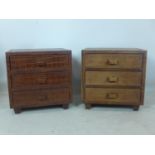 A pair of faux crocodile skin bedside chests with makers label for 'Inthai', H.50 W.50 D.40cm