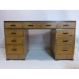 An Art Deco walnut and part ebonized pedestal desk, H.78 W.137 D.68cm