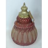A large 20th century pressed glass light fitting in clear and cranberry-coloured glass with gilt