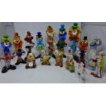 A collection of 8 Murano glass clowns together with 8 ceramics clowns