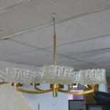 A 1960'70's brass chandelier with glass shades