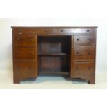 An oak kneehole desk, having two long over 6 short drawers, on bracket feet, H.76 W.112 D.50cm