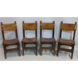 A set of four late 19th/early 20th century oak dining chairs, with original tan leather upholstery