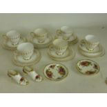 Six Queen Anne bone china side plates, 6 matching teacups and saucers, each with gilt floral design,