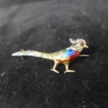 A Victorian yellow and rose gold brooch in the form of a pheasant with a brightly-coloured enamel