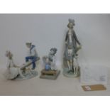 Three Lladro figures and a plaque, to include a boy and girl on a seesaw, broken fingers to one hand