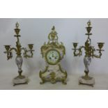 A 20th century French gilt metal and marble clock and matching candelabra's