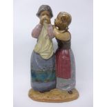 A Lladro figural study of a girl consoling a crying lady, marked to base, H.28cm