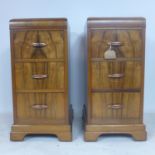 A pair of walnut pedestal chests of three short drawers, raised on bracket feet, H.71 W.32 D.46cm