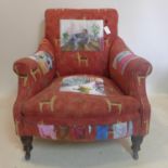 A 20th century armchair, the upholstery painted with figures in domestic scenes and geoemtric and