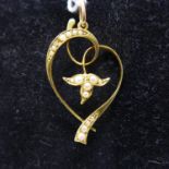 A 15ct yellow gold, Art Nouveau seed pearl pendant set to a yellow gold pendant loop, 3.5 x 2cm