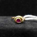 An 18ct yellow gold ruby and diamond stylised snake ring on a rose gold shank, size: N, 2.4g