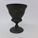 A 19th century bronze footed cup adorned with two classical busts and Etruscan motifs, H: 11cm, Dia: