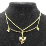 A mid-Victorian, 15ct yellow gold chain necklace suspended by seed pearl-studded leaf drops, L: