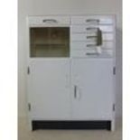 A vintage medicine/dentists cabinet, with 2 sliding doors and 6 drawers above 2 cupboard doors, H.98