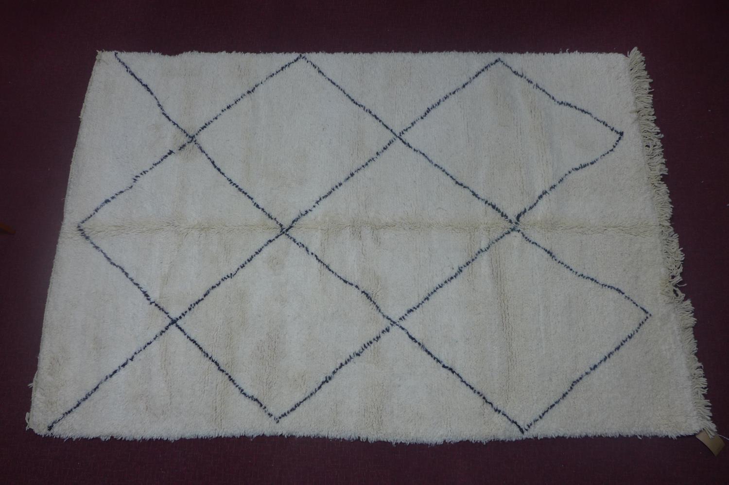 A Moroccan Berber Beni Ourain carpet, with diamond design, 263 x 166cm