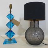 Two lamps: One composed of blue faceted glass, H: 49cm and a glass and mesh example with black shade
