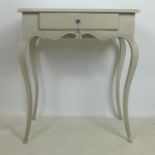 A French painted side table, single drawer raised on cabriole legs, H.82 W.70 D.44cm