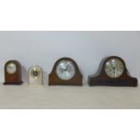 A collection of four clock to include a Napolean hat clock
