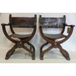 A pair of early 19th century oak Savonarola chairs, with original studded leather