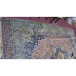 A large 20th century English wool made Persian design Tabriz carpet, central floral medallion on a