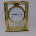 A Tiffany & Co, brass mounted mantle clock having four ribbed columns, circular white dial with
