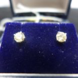 A boxed pair of 18ct white gold and round, brilliant-cut diamond stud earrings (total 0.80 carats)