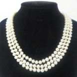 A 9ct yellow gold clasped, 3-strand cultured pearl necklace, (cream-coloured pearls) L: 45cm, pearl:
