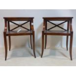 A pair of Regency style mahogany lamp tables, with brush slides, raised on sabre legs, H.60 W.41 D.