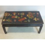 A mid 20th century, Chinese black lacquered coffee table decorated with hand-painted vases and