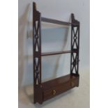 A Regency style mahogany wall shelf with drawer, H.70 W.40 D.10cm