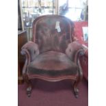 A Victorian mahogany spoon back armchair, with button back velour upholstery, raised on cabriole