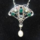 A sterling silver and plique a jour enamel necklace in the Art Nouveau style set with cabochon green