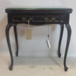 A Victorian carved mahogany card table, with single drawer, raised on cabriole legs, H.77 W.70 D.