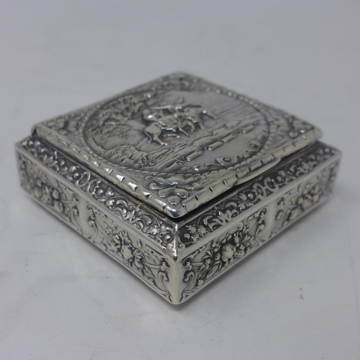 A French silver snuff box, with repousse embossed decoration with vignette of scene from Exodus of