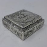 A French silver snuff box, with repousse embossed decoration with vignette of scene from Exodus of
