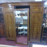 An Edwardian inlaid mahogany triple wardrobe/linen press, with linen drawers, H.210 W.204 D.60cm