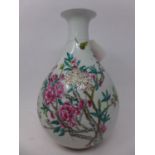 A Chinese famille rose ovoid vase with elongated neck, hand-painted with blossoming flowers, with