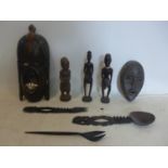 A collection of 20th century hand-carved African wooden items to include a mask, a mask lamp, 3