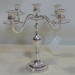 A large, Continental silver candelbra having 5 sconces and on a raised octagonal base, Hallmarked