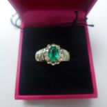 A boxed 14ct yellow gold emerald and diamond ring, Size: P 1/2, 3.9g
