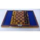 A complete cased chess set with decorative marquetry work to the exterior and interior, open: 26.5 x