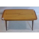 A retro inlaid coffee table raised on tapered legs, H.40 W.81 D.43cm
