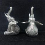 A pair of silver plated novelty condiments in the form of seated elephants, 8 x 5cm each, Gross: