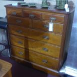 A Victorian Aesthetic movement mahogany chest of drawers, with an arrangement of 8 drawers, raised