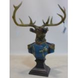 A resin bust of a stag in military officer's uniform, raised on socle base, H.61 W.47cm