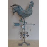 A sheet metal cockerel weather vane, in the verdigris finish, H.93cm