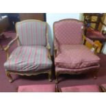 A pair of early 20th century French walnut bergere armchairs