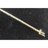 A 9ct yellow gold and diamond tennis bracelet, approx. 1ct total